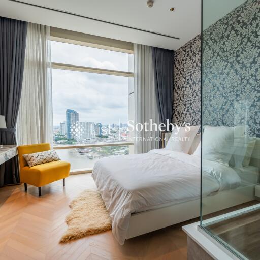 Modern bedroom with large window and city view