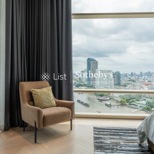 Spacious living room with a large glass window offering a beautiful city view