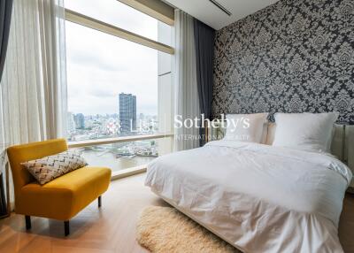 Modern bedroom with large windows and city view