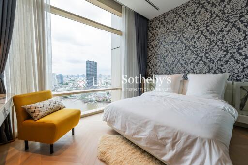 Modern bedroom with large windows and city view