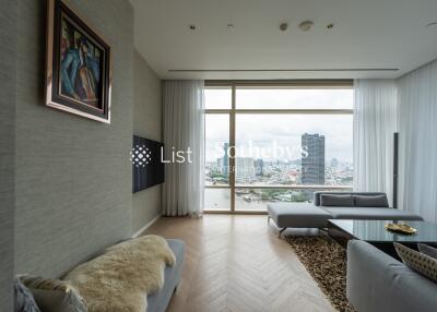 Modern living room with large window and city view