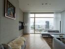 Modern living room with large window and city view