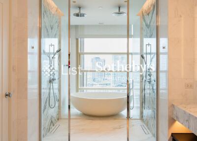 Modern bathroom with bathtub, double shower, and vanity