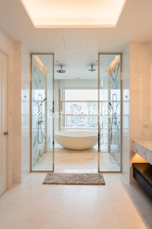 Modern bathroom with bathtub, double shower, and vanity