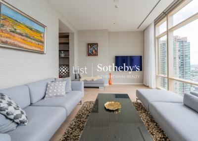 Modern living room with large windows and city view