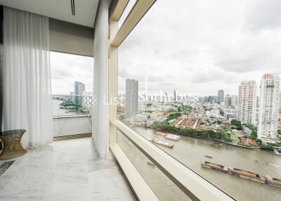 High-rise balcony with city and river view