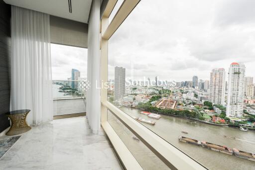 High-rise balcony with city and river view