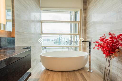 Modern bathroom with a freestanding bathtub and large window