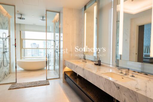 Luxurious modern bathroom with panoramic view, double vanity, separate shower and freestanding bathtub