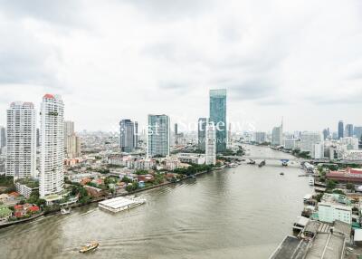 High view of a city with a river and multiple high-rise buildings