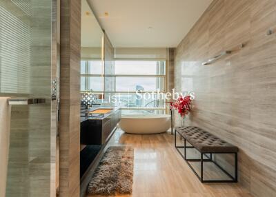 Modern bathroom with a freestanding tub and large window