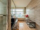 Modern bathroom with a freestanding tub and large window