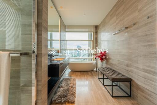 Modern bathroom with a freestanding tub and large window