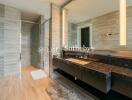 Modern bathroom with elegant fixtures and walk-in shower