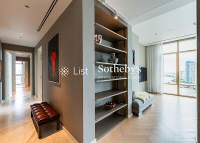 Modern living area with hallway and view of another room with large windows