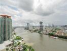 Panoramic view of a city with river and high-rise buildings