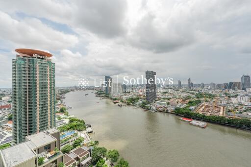 Panoramic view of a city with river and high-rise buildings