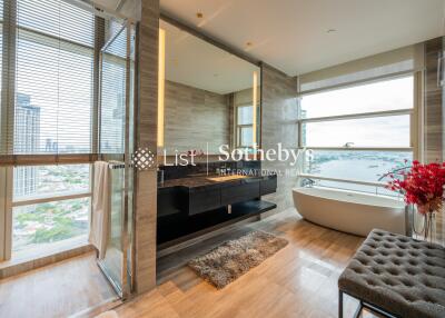 Modern bathroom with large windows and city view