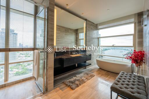 Modern bathroom with large windows and city view