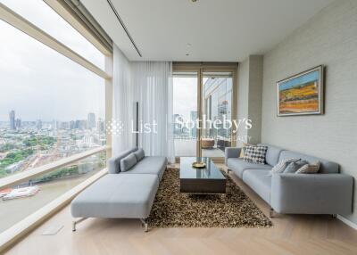 Modern living room with large windows and city view