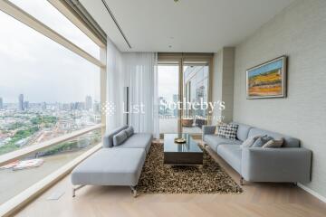 Modern living room with large windows and city view