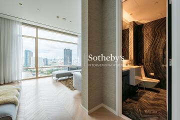 Modern living room with city view and adjacent luxurious bathroom