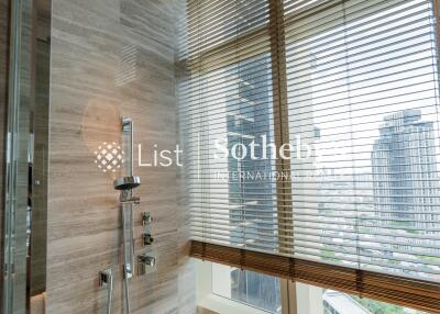 Modern bathroom with tall windows and a shower