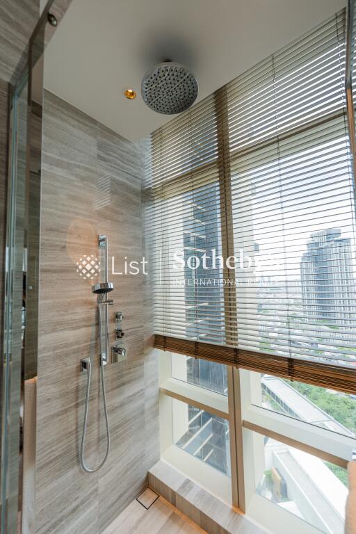 Modern bathroom with tall windows and a shower