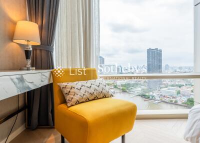 Living room with a yellow armchair and a city view