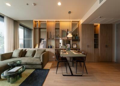 Modern living room with dining area and built-in shelving