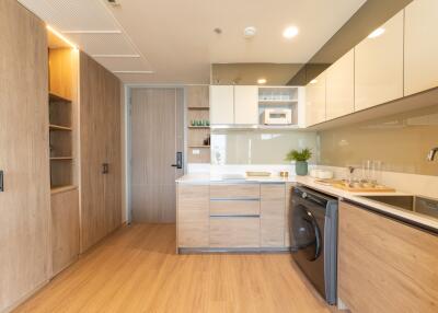 Modern kitchen with wooden cabinets and white countertop