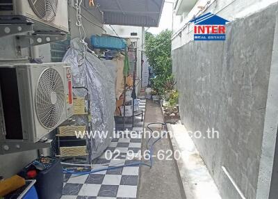 Narrow alleyway with utility installations