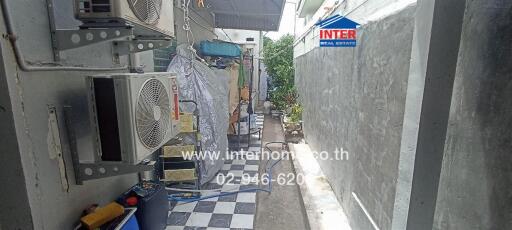 Narrow alleyway with utility installations