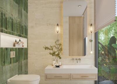 Modern bathroom with green tiled wall, floating sink, and large window