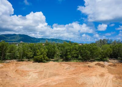 Unconstructed land plot with scenic mountain and tree views