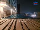 Outdoor pool at night in high-rise building