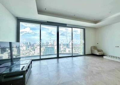 Spacious living room with a large window view