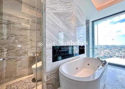 luxury bathroom with bathtub and city view