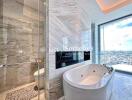 luxury bathroom with bathtub and city view