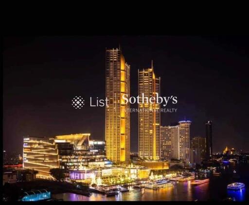 Night view of illuminated high-rise buildings near waterfront