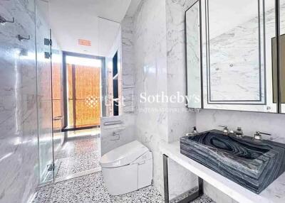 Modern bathroom with marble wall and countertops