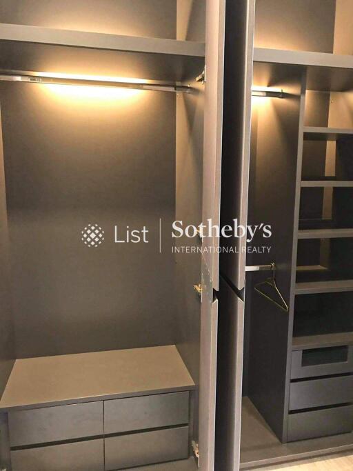 Spacious walk-in closet with ample storage and lighting