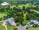 Aerial view of large property with surrounding greenery