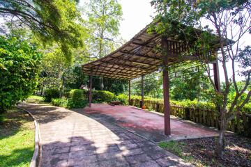 Covered outdoor patio with greenery