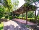 Covered outdoor patio with greenery