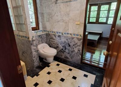 Bathroom with marble walls and floor