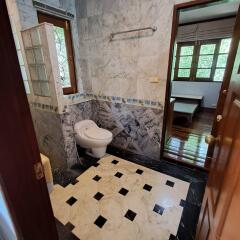 Bathroom with marble walls and floor