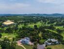 Aerial view of a property with surrounding greenery