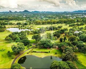 Aerial view of a lush landscape with lakes and greenery