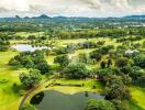 Aerial view of a lush landscape with lakes and greenery